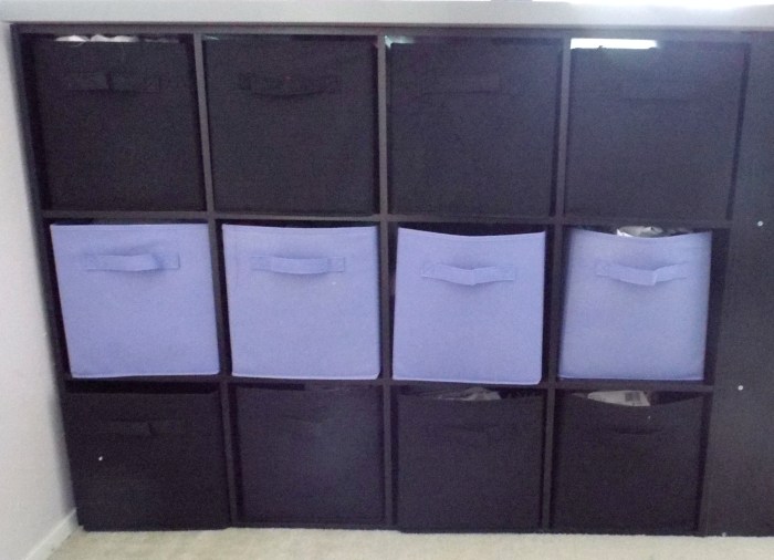 My main sewing side. The top two rows are fabric and the bottom row is patterns.