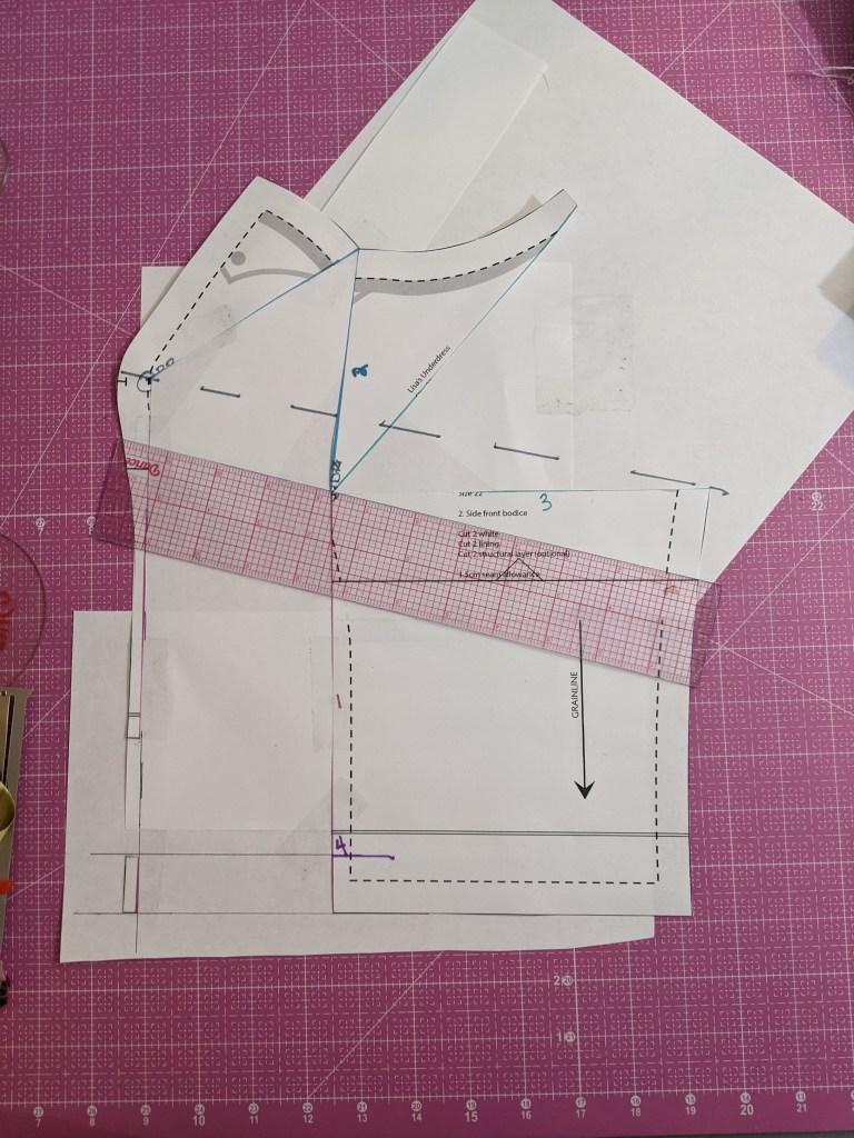 Overhead shot of side front bodice piece. A dotted grey line runs diagonally from the bust point to the side seam. 